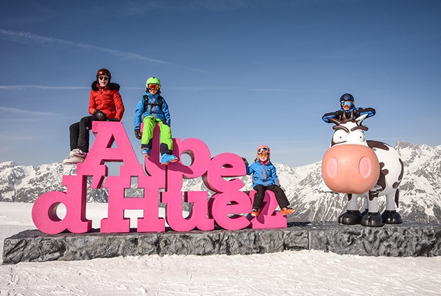 Alpe d' Huez childcare, kids on letters.