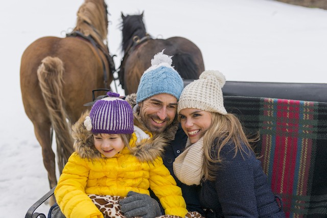 Family on horse drawn carriage in Ischgl