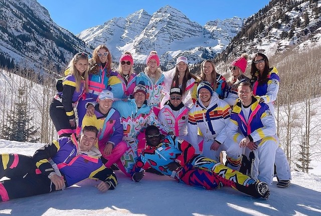 Group in bright neon sustainable ski gear